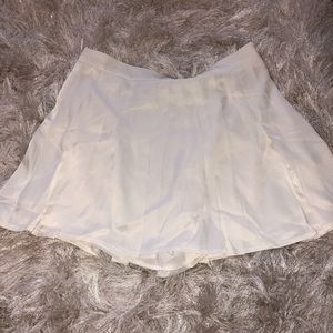 Pleaded skort. Tennis/skate zip